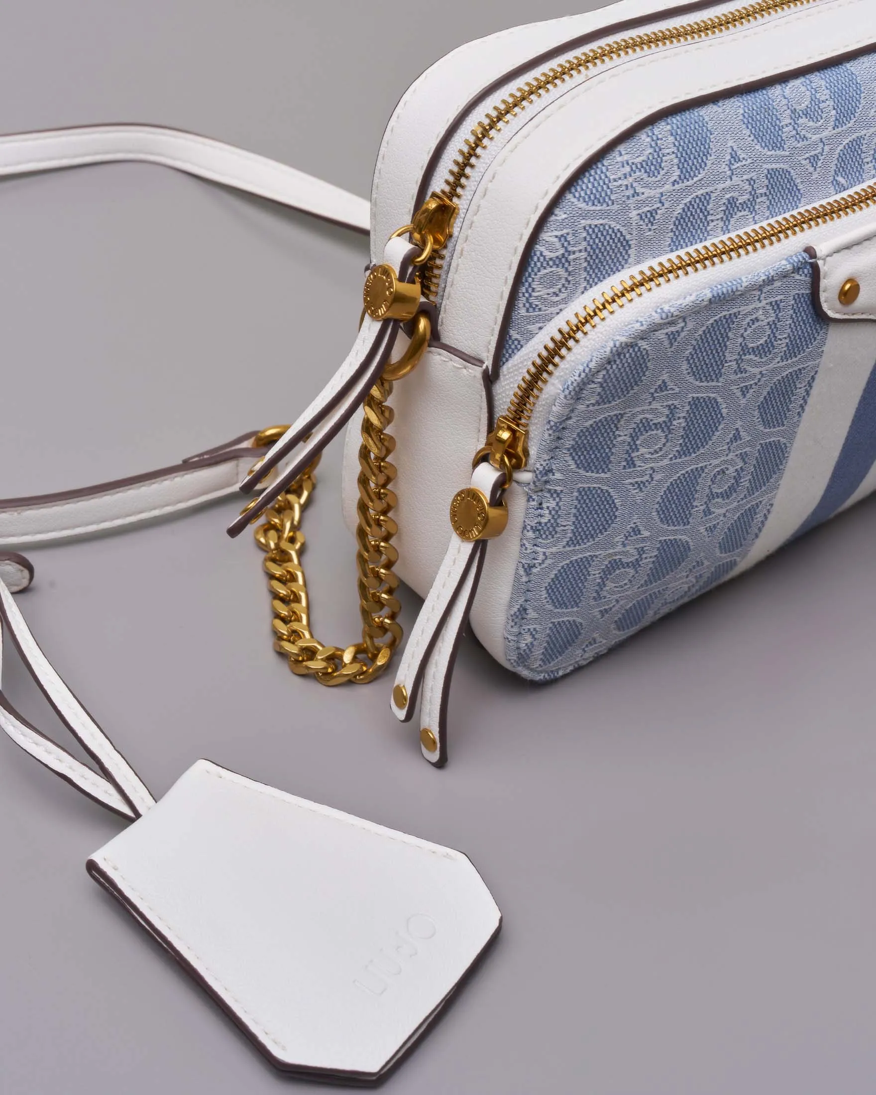 Cross bag in canvas a motivo monogram beige e noce con profili ed inserti in similpelle lilla